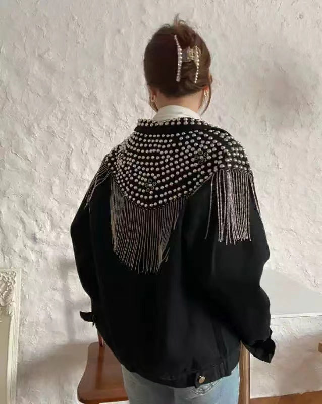 Loose fitting denim jacket with wicker fringe trim