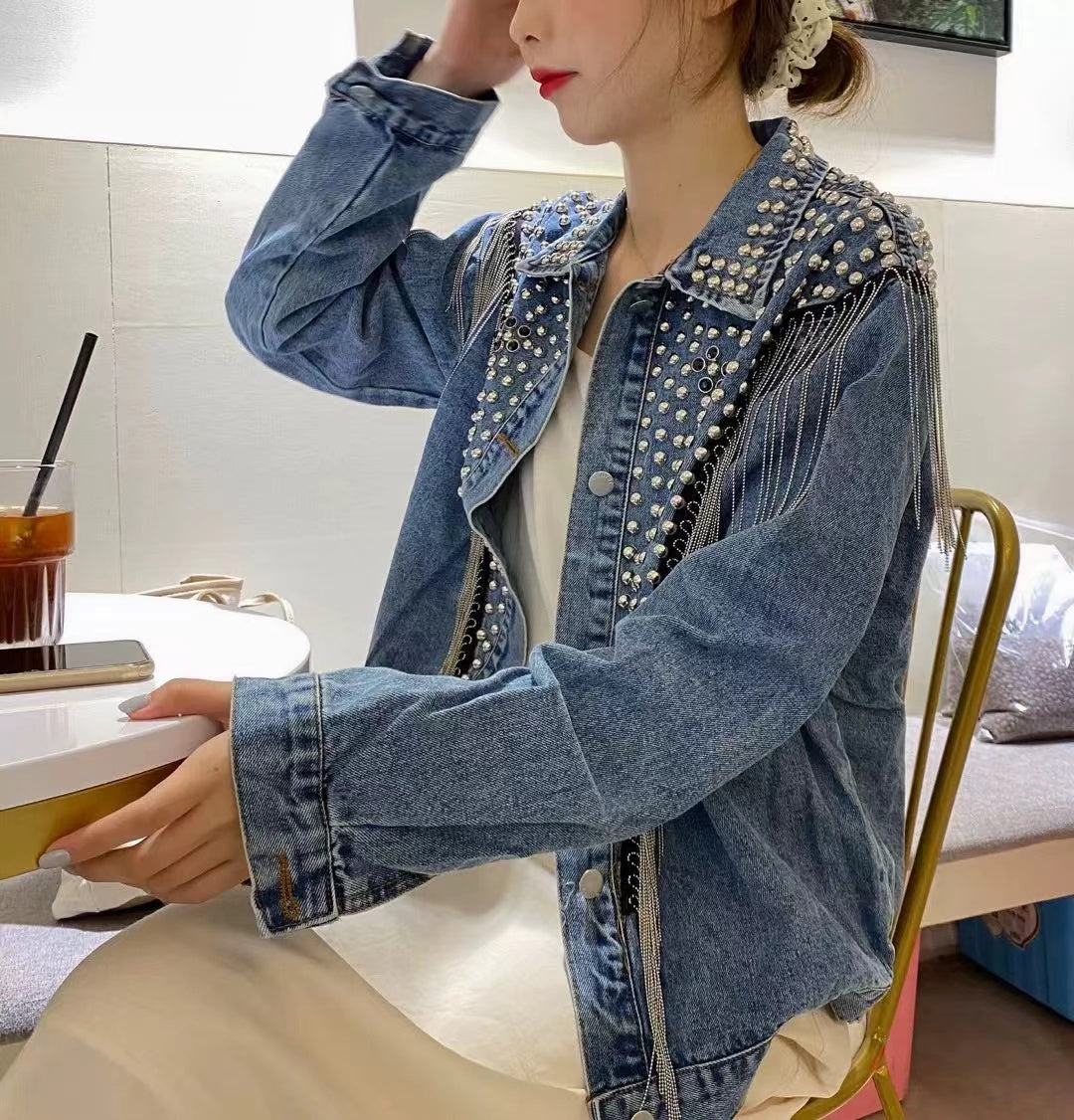 Loose fitting denim jacket with wicker fringe trim