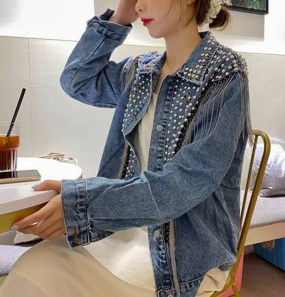 Loose fitting denim jacket with wicker fringe trim